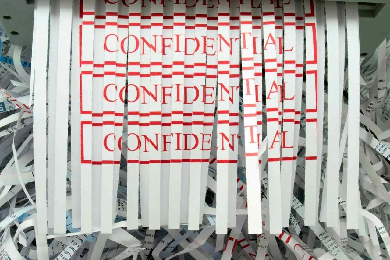 confidential paper being shredded